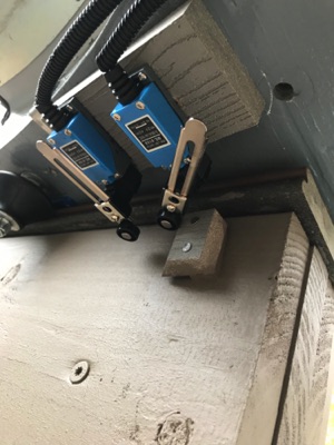 Switches stop sled drive at just the right spots